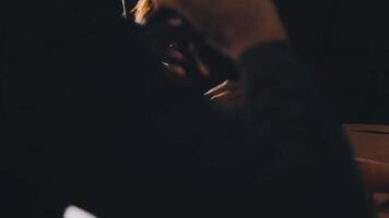 A person sitting at a table with a glass of wine video