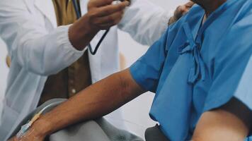 A doctor is examining a patient's arm with a stethoscope video