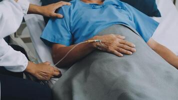 A man in a hospital bed with an iv drip video