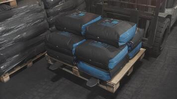 There are Stacked Bags carefully placed on a Pallet inside the Storage Facility for organization video