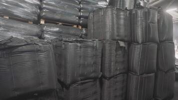 Large Bulk Bags of Industrial Material are currently stored in a designated Storage Facility video