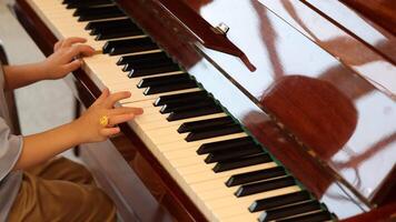 A Child Joyfully Engaged in Playing the Piano Emphasizing Musical Learning and Pure Joy video