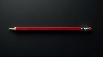 Red Pencil on Dark Background Flat Lay Writing Tool Concept photo