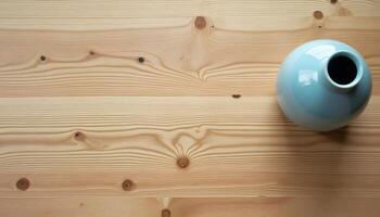 Stylish Blue Vase on Light Wooden Background Still Life Top View photo
