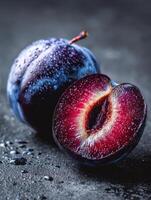 Ripe Plum With Glowing Sliced Core Highlights Natural Beauty and Texture in Elegant Presentation photo