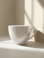 A Single White Mug in Soft Light Minimalist Product Photography. photo