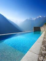 Infinity Pool with Stunning Mountain View Luxury Resort in the Alps. photo