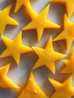 Bright Yellow Star-Shaped Pepper Slices for Kids Meals Arranged on a Light Background in a Fun and Playful Way photo