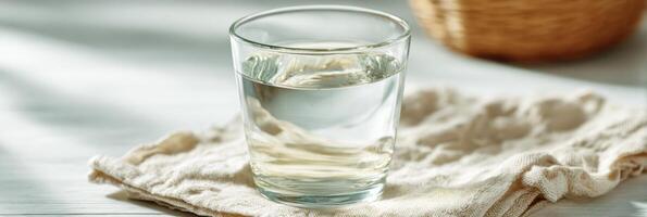 Warm Salt Water Glass With Gargling Instructions on a Soft Light Background for Throat Care at Home photo