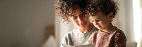 Parent and Child Engage in Communication Through Picture Cards in Soft Natural Light photo