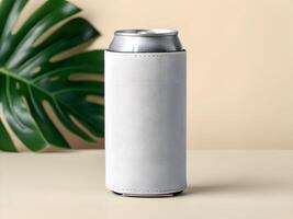 White Textured Can Cooler with Tropical Leaf on Beige Background photo