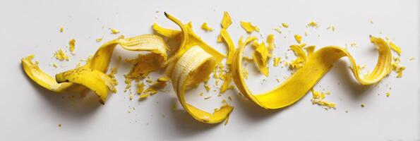 Banana Peel Abstract Composition on a Clean White Background Showcasing Bright Colors and Unique Shapes Formed by the Peel photo