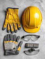 Safety Equipment Flat Lay With Hard Hat, Gloves, and Goggles on Neutral Background for Construction and Industrial Use photo