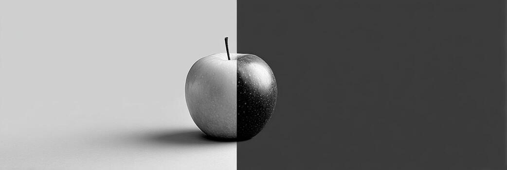 Contrast of Life Depicted Through a Colorful Apple Set Against a Minimalist Grayscale Background Showing Simplicity and Elegance in Design photo