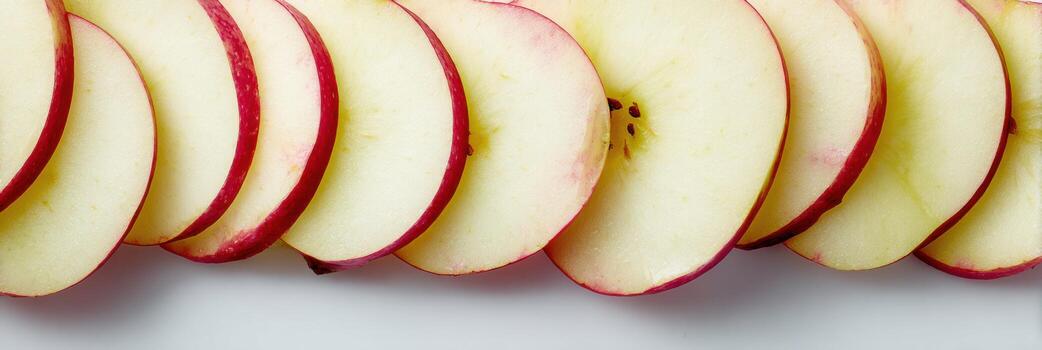Sliced Apples Arranged Vertically With a Fading Effect Into the Background for a Fresh and Vibrant Display Suitable for Culinary Arts photo