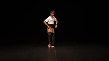 Dynamic Male Dancer in Traditional Outfit on Stage video