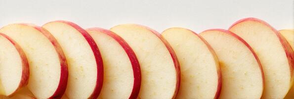 Sliced Apples Arranged Vertically With a Clean Background and Blank Upper Zone for Creative Design and Presentation photo