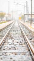 Rainy Train Tracks Converging on a Misty Horizon A Poetic Glimpse of Urban Transit and the Endless Journey Ahead on a Wet Day photo