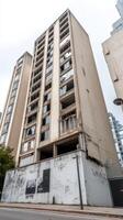 Haunting Urban Decay Abandoned High-Rise Building with Broken Windows and Graffiti, a Gritty Testament to Neglected City Architecture photo