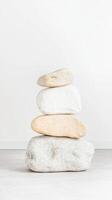 Meditative Stacked Stones A Serene Symbol of Balance and Tranquility. Natural Rock Cairn Art for Zen, Mindfulness, and Inner Peace on a Minimalist Canvas photo