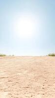 Vast Golden Sand Desert Landscape Under a Bright Blue Sky A Serene Natural Horizon with Subtle Textures and Warm Sunlight, Evoking Tranquility photo