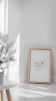 Elegant framed abstract botanical art in a serene minimalist white interior, bathed in soft natural light, perfect for modern home decor. photo