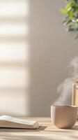 Cozy Morning Ritual Steaming Tea Cup, Open Book, and Soft Sunlight Creating a Peaceful Ambiance for Relaxation and Contemplation photo