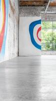 Vibrant Abstract Art Adorning a Modern Industrial Loft Space with Bright Natural Light and Polished Concrete Floors photo