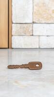 Bronze Key Resting on Polished Marble A Symbol of Secure Home Ownership, New Beginnings, and Unlocking Future Opportunities for Your Lifestyle photo