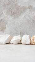 Serene Composition of White Natural Stones and Seashell on a Textured Background. Peaceful Coastal Elements for Tranquil Design. photo
