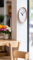 Capturing the essence of modern minimalist interior design a sleek wooden wall clock, natural light, and inviting cafe-style wooden furniture creating a serene, contemporary space photo
