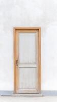 Timeless Wooden Door on White Textured Wall A Rustic Architectural Entrance with Vintage Charm and Minimalist Design, Evoking Serene Simplicity photo