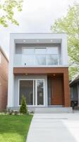 Contemporary Urban Home A Modern Two-Story Residential Building with Sleek Design, Wood Paneling, and Lush Greenery, Showcasing Elegant Architecture photo