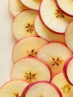 Sliced Apples Arranged Vertically With Blank Upper Area and Smooth Background for Minimalistic Presentation photo
