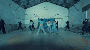 Vintage photo of a group of young people practicing dance moves in a studio with a retro aesthetic during the night video
