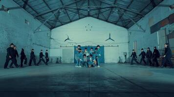 Group of young people practicing dance moves in a studio during the night video