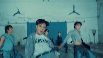 Group of young dancers in urban setting performing a routine with dynamic poses video