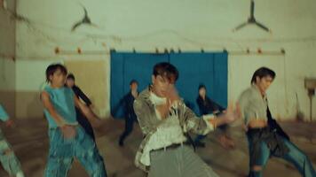 Blurred motion of people walking in an indoor space conveying a sense of movement and chaos during the night video