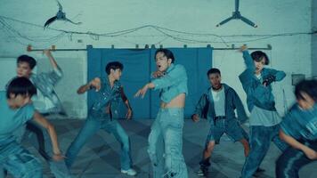 Group of young adults in a dance rehearsal inside a studio with industrial vibes. video