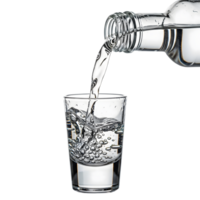 A clear shot glass being filled with vodka from a bottle, creating bubbles and splashes against a transparent background png
