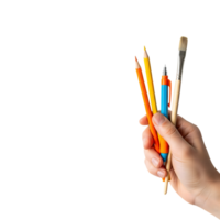A hand holds art supplies, including pencils, a pen, and a brush, isolated on transparent background png