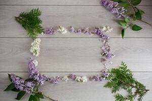 Flower frame of white and purple lilac with free space photo