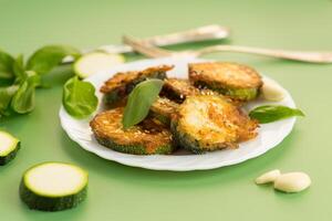 Seasonal quick-fried zucchini with aromatic garlic and sesame . photo