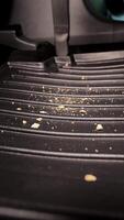 Garbage and dirt in the car. Cookie crumbs fall on the car mat in the car. Garbage in the car interior. video