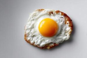 Fried egg sunny side up in studio setting photo