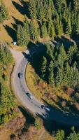 Road in the mountains and car traffic. Beautiful landscape of nature in the mountains and a small road loaded with cars and motorcycles. video