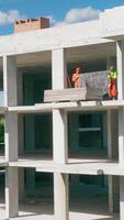 Construction of a monolithic house. Builders put up plasterboard. Multi-storey building with monolithic. Modern industrial monolithic construction video
