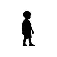 Silhouette of a young boy standing and looking to the side isolated on white background vector