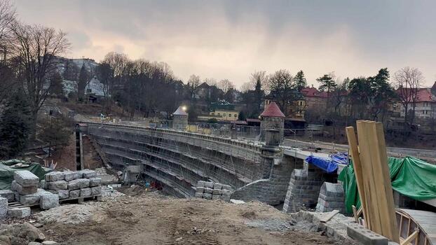 An active urban construction site displaying stone structures and a variety of materials for a new developing project photo