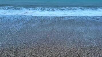Immerse yourself in the serene and calming beauty of gentle waves softly lapping at the shore at twilight photo